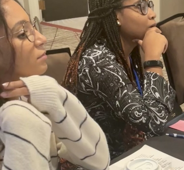 two students looking right